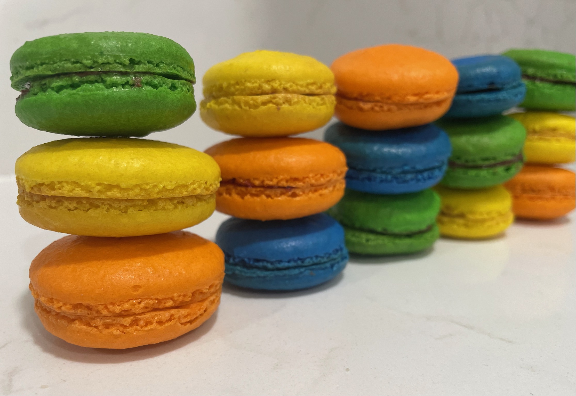 Rainbow macarons in various pastel colors